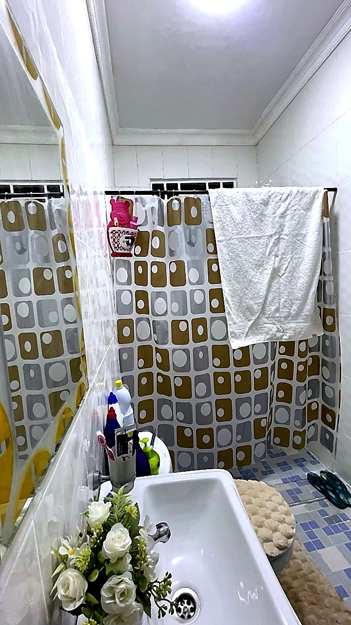Clean bathroom vanity and mirror area at Jeffston Court Hostel